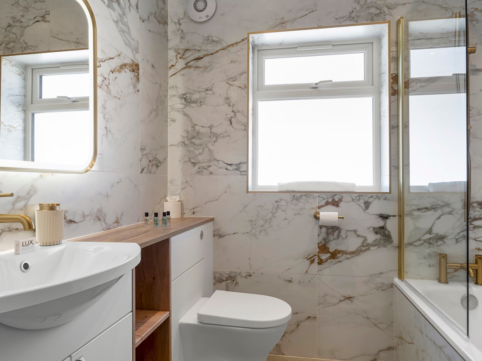 Accessible bathroom with grab rails and step-free shower